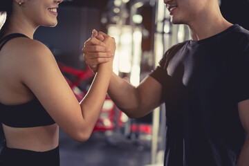 Close up handshake of sporty greeting partner exercise workout at fitness gym