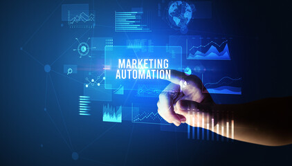 Hand touching MARKETING AUTOMATION inscription, new business technology concept