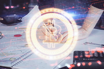 Man's hands working with notes background. Cryptocurrency and finance concept.