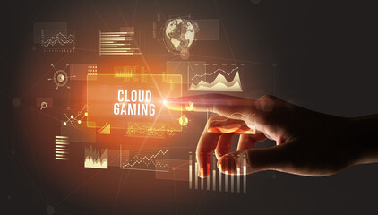 Hand touching CLOUD GAMING inscription, new business technology concept