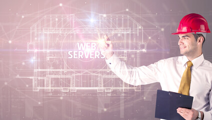 Handsome architect with helmet drawing WEB SERVERS inscription, new technology concept