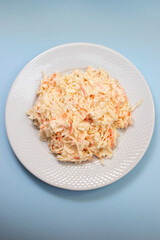 cabbage and carrot salad on white plate