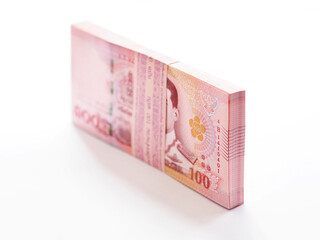 pile of Thai 100 baht banknotes on white background