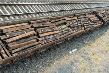 Wooden railway sleepers in a freight train