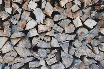 Pile of firewood full frame textured effect