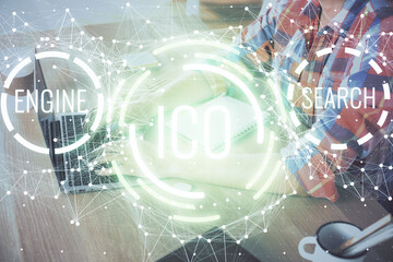 Blockchain theme hologram with man working on computer on background. Concept of crypto chain....