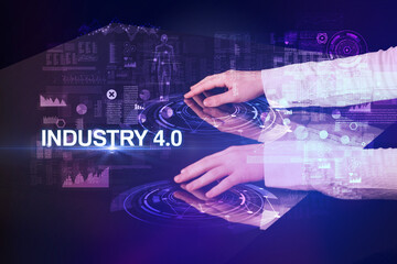 Businessman touching huge display with INDUSTRY 4.0 inscription, modern technology concept