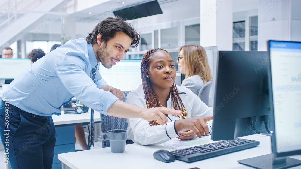 Poster in the busy corporate office: manager talks to businesswoman who works on desktop computer. business