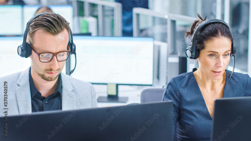 Poster in modern open space office: team of customer support people and salesmen working at their desktop c