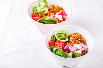 Fresh salad with couscous, tomatoes, cucumber, radish and chard.