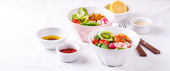 Fresh salad with couscous, tomatoes, cucumber, radish and chard.