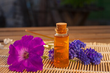 Essential oil of muscari flower on a table in beautiful bottle