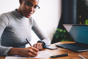 Experienced afro american female owner of business signing contract with corporation for making...