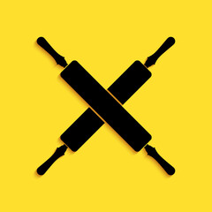 Black Crossed rolling pins icon isolated on yellow background. Kitchen utensils and equipment. Long shadow style. Vector.
