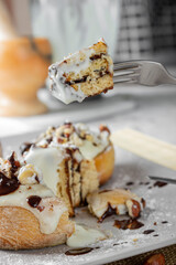 original cinnabon rolls with chocolate-cream sauce and hazelnuts
