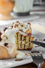 original cinnabon rolls with chocolate-cream sauce and hazelnuts