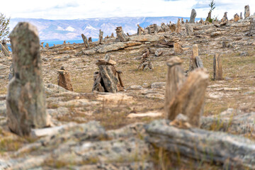 Balanced stone pyramids on lake shore. Zen rock, concept of balance and harmony