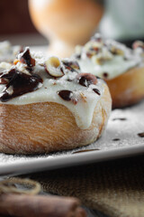 original cinnabon rolls with chocolate-cream sauce and hazelnuts