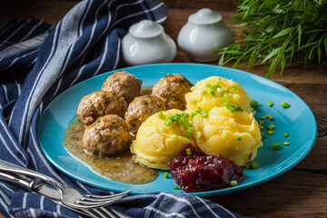 Meatballs with potatoes in dill sauce.