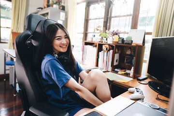Portrait of happy smile young adult asian woman at home work space.
