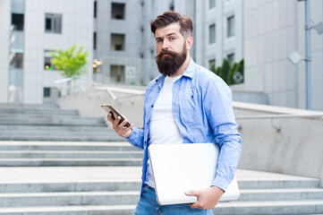 Phone you always desired. Bearded man use phone outdoors. Mobile phone messaging. SMS message. Cell...