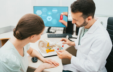 Man, audiologist, consultation an adult patient. Audiologist and patient, hearing diagnostic,...