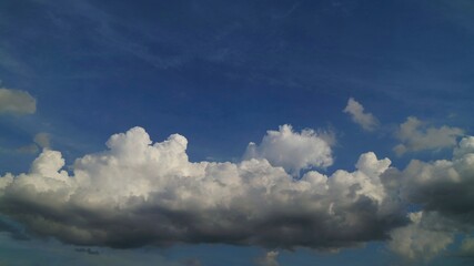 Blue sky with big shape cumulus cloud in the rainy day. Soft focus. Low key. Nature background concept.