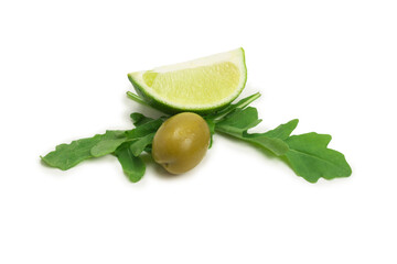 Two olives, piece of lemon and leaves of arugula isolated on white