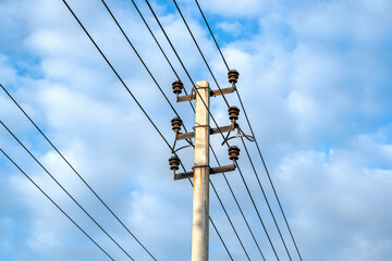 Electricity pole against blue sky background, High voltage electricity pylon