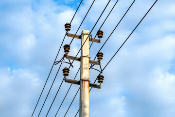 Electricity pole against blue sky background, High voltage electricity pylon