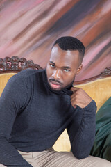 Handsome Black man relaxing thoughtfully