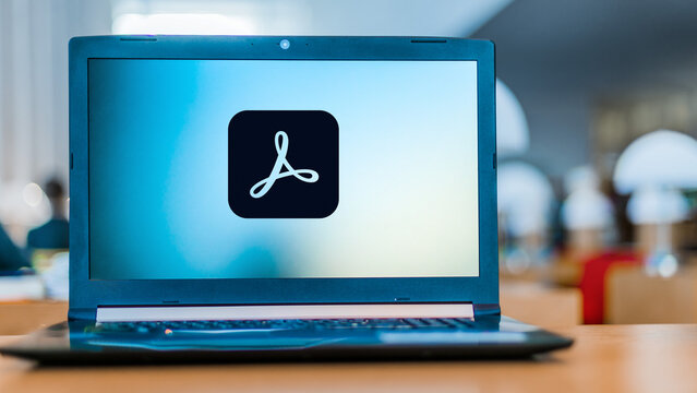 Laptop computer displaying logo of Adobe Acrobat