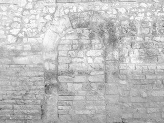 Fototapeta na wymiar White texture of an old wall with the traces of an old door - old vintage texture design - large image in high resolution