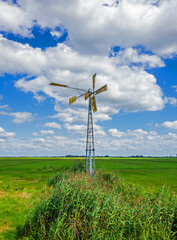 Fototapeta na wymiar Panoramic view of a meadow with old fashioned windmill near Eemnes, Netherlands 