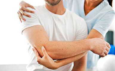 physiotherapist doing treatment with patient in bright office