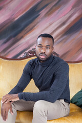 Fototapeta premium Handsome black man sitting thoughtfully