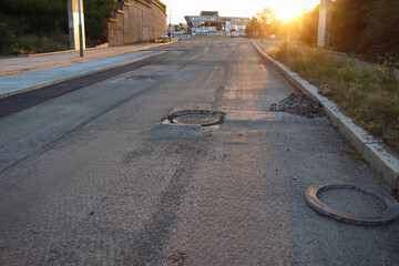 Unusual sunset in the city with a view of the road reconstruction