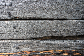 Burnt wood planks, black and white background of burnt boards.