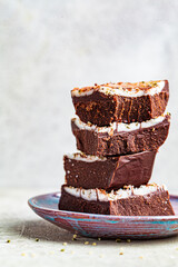 Raw vegan chocolate bars with nuts and seeds. Healthy sugar-free dessert.