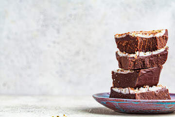Raw vegan chocolate bars, copy space. Healthy sugar-free dessert.