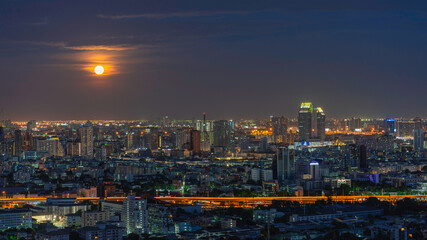 Fototapeta na wymiar Beautiful aerial cityscape view of Bangkok city at night and full moon