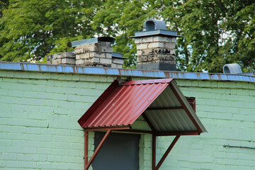 icon roof with new brown roofing tiles on residential property. banner on  roof for roofers....