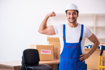 Young male professional mover doing home relocation
