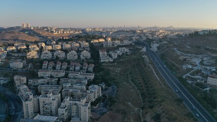 Naklejka premium Israel and Palestine town divided by wall, aerial pisgat zeev and anata refugees camp, Jerusalm israel 