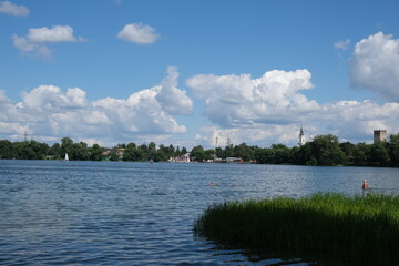 Summer day. Beautiful clouds and blue sky. Clean lake.
