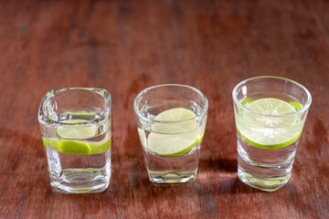 Three Soda water with lemon are in three glass stlye
