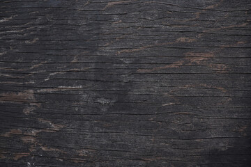 Obraz premium Dark texture of an old cracked paint on the door