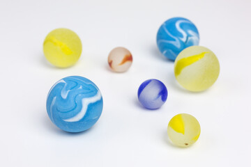 group of frosted glass marbles in blue, yellow and red
