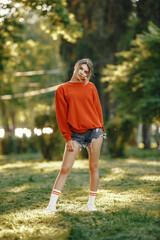 Portrait of beautiful woman. Model in summer city. Girl look at the camera.