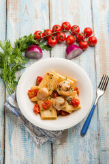 paccheri pasta with scallop tomatoes and parsley